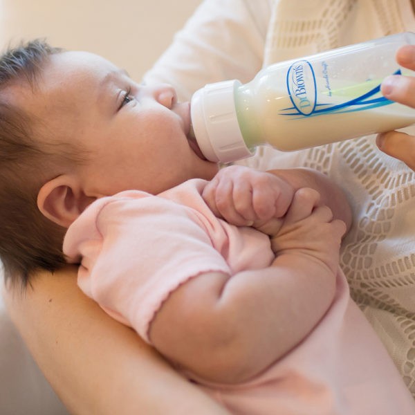 Baby drinking from a Dr. Brown's bottle