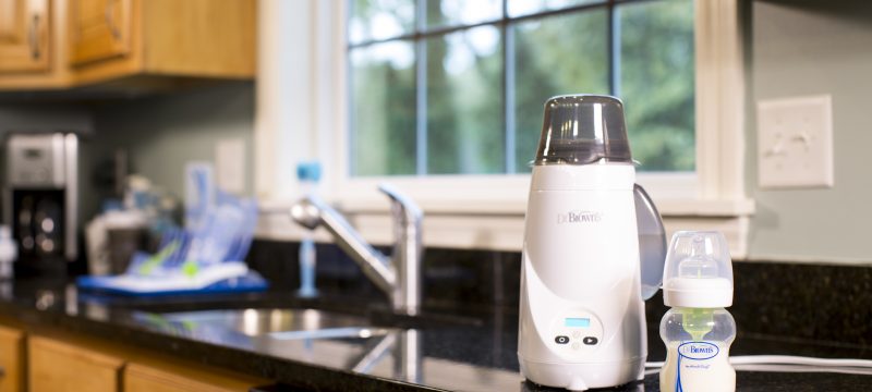 Bottle warmer and bottle sitting on counter