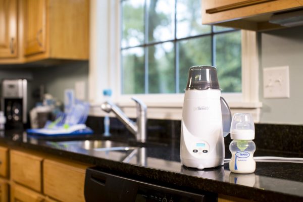 Bottle warmer and bottle sitting on counter